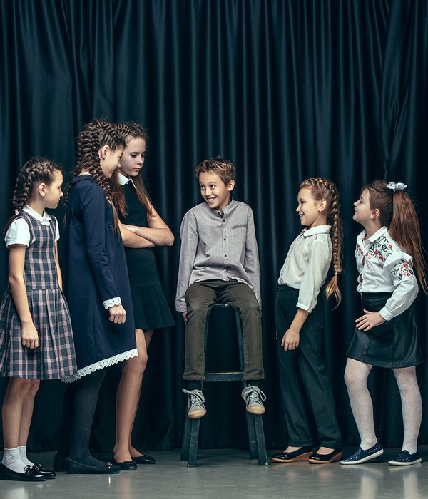 cute-stylish-children-dark-studio-beautiful-teen-girls-boy-standing-together