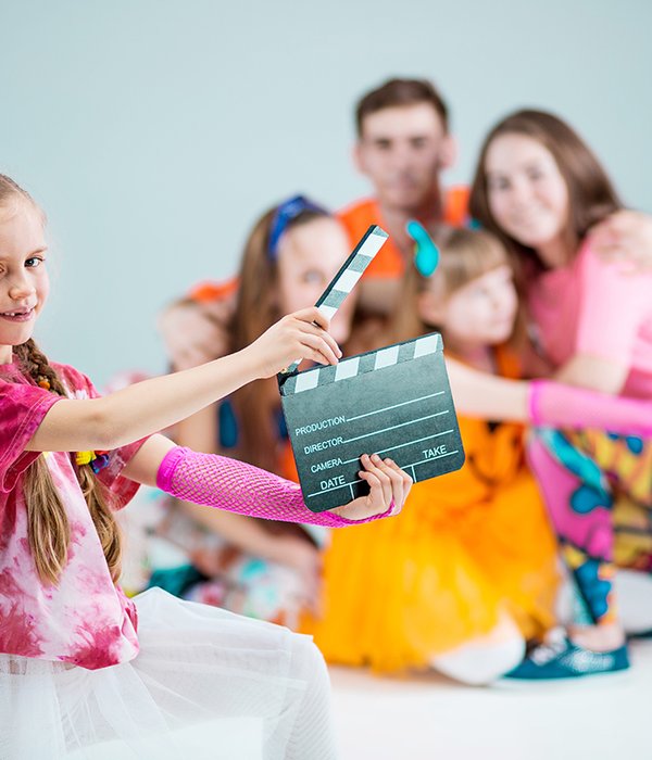 girl-using-clapperboard-with-group-hip-hop-dancers